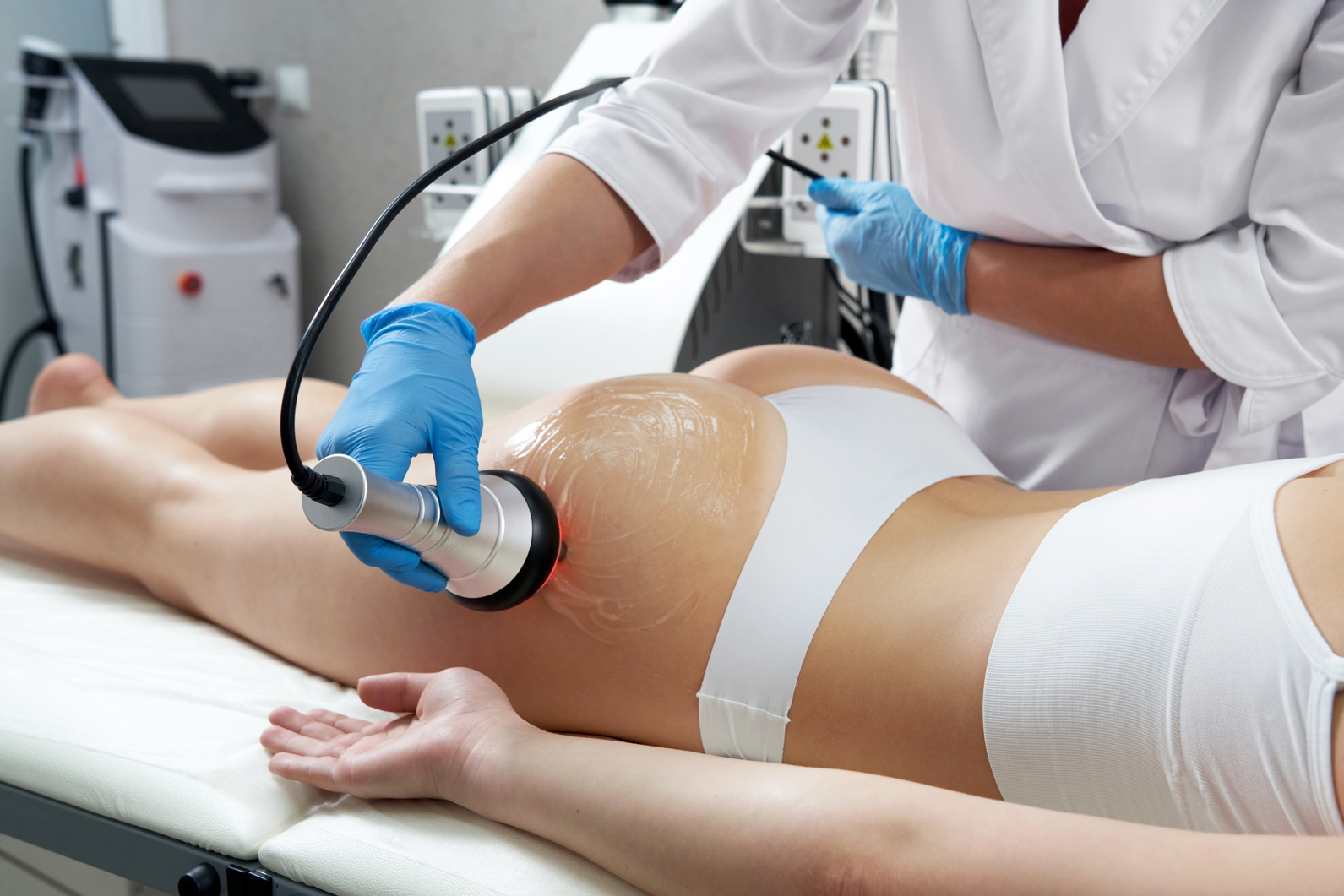 Ultrasound Cavitation Body Contouring Treatment. Woman Getting anti-Cellulite and anti-Fat  in Beauty Salon
